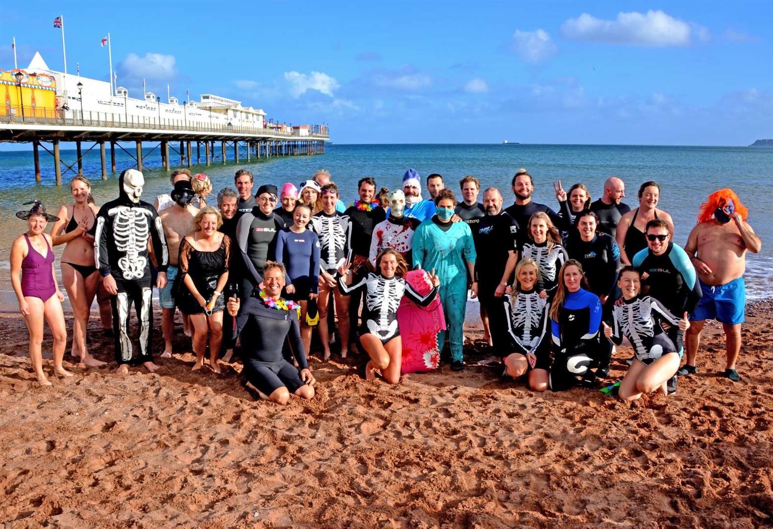 Allie Dart celebrating completing her 365th swim with her local community (Allie Dart/Cornish Seal Sanctuary/PA)