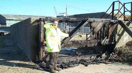 Businessman Paul Stevens inspects the damage. Picture: LYNDA MITCHELL