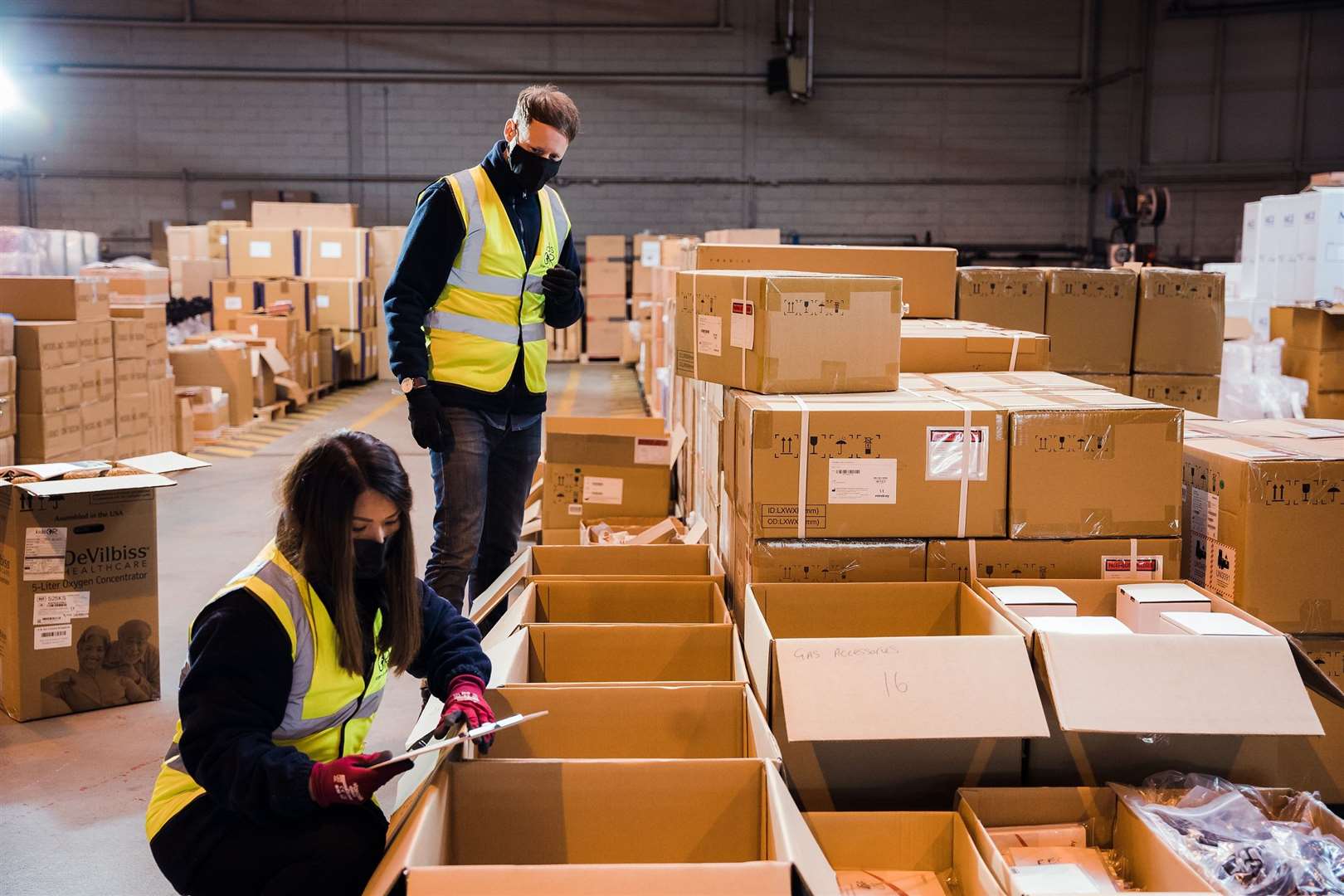 Staff at the Dundee depot prepare the equipment that will be shipped (KidsOR/PA)