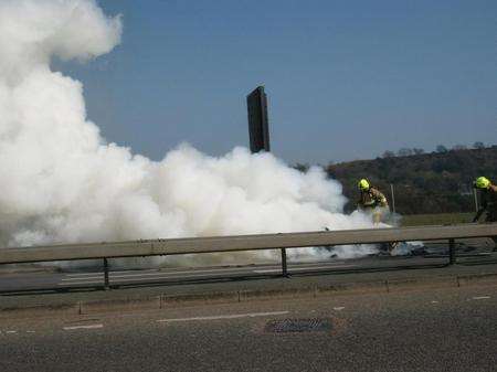 Firefighters tackle a vehicle fire on the A289, Wainscott