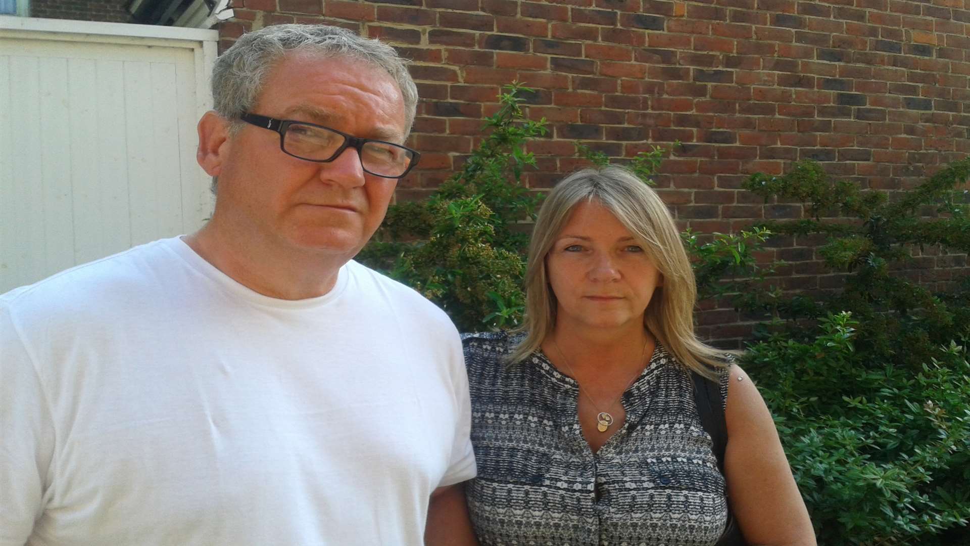 Parents Tony Woodmansee and Sally Woodmansee outside court