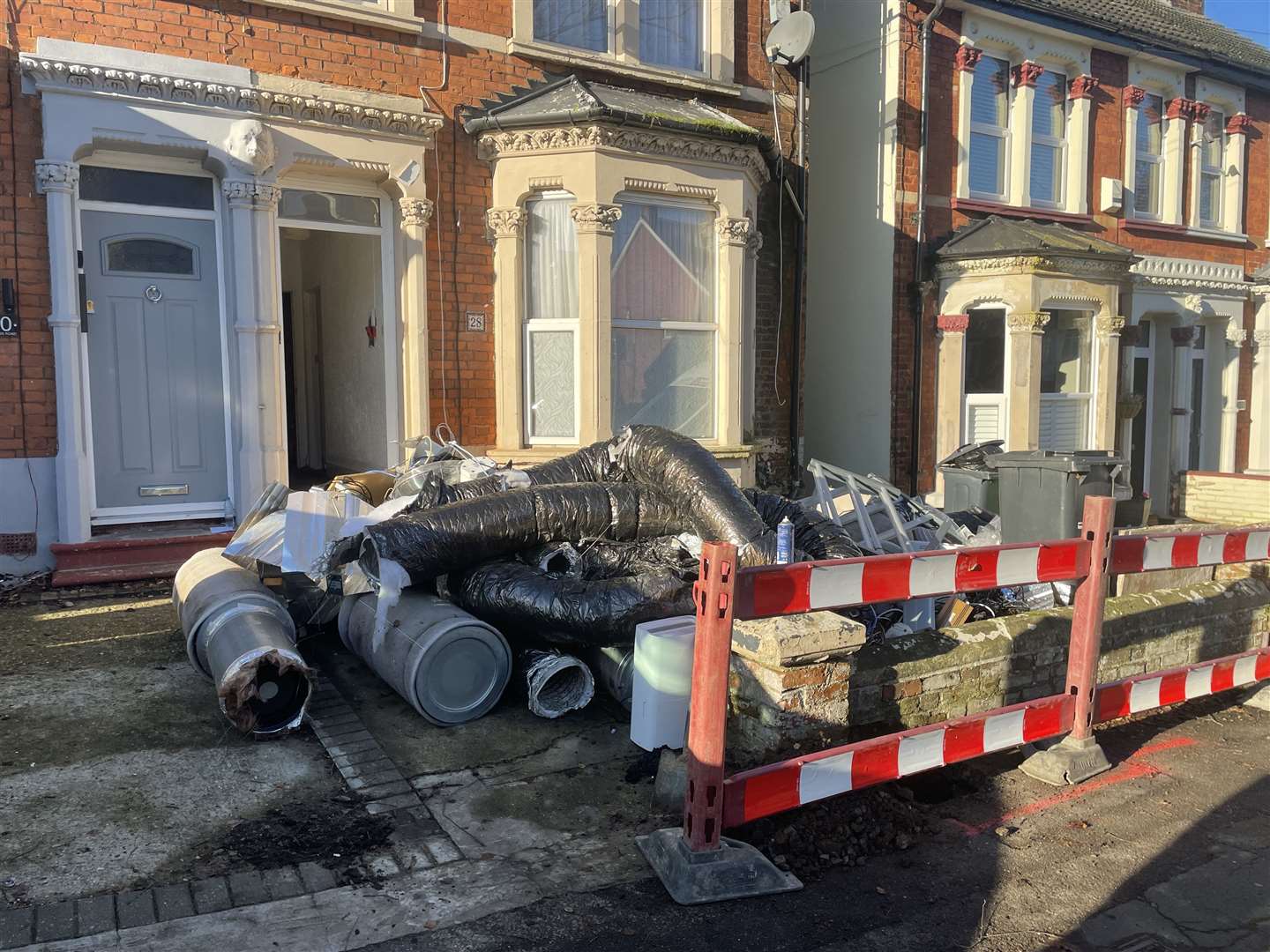 Tubing and other equipment laid in front of the house in Hastings Road