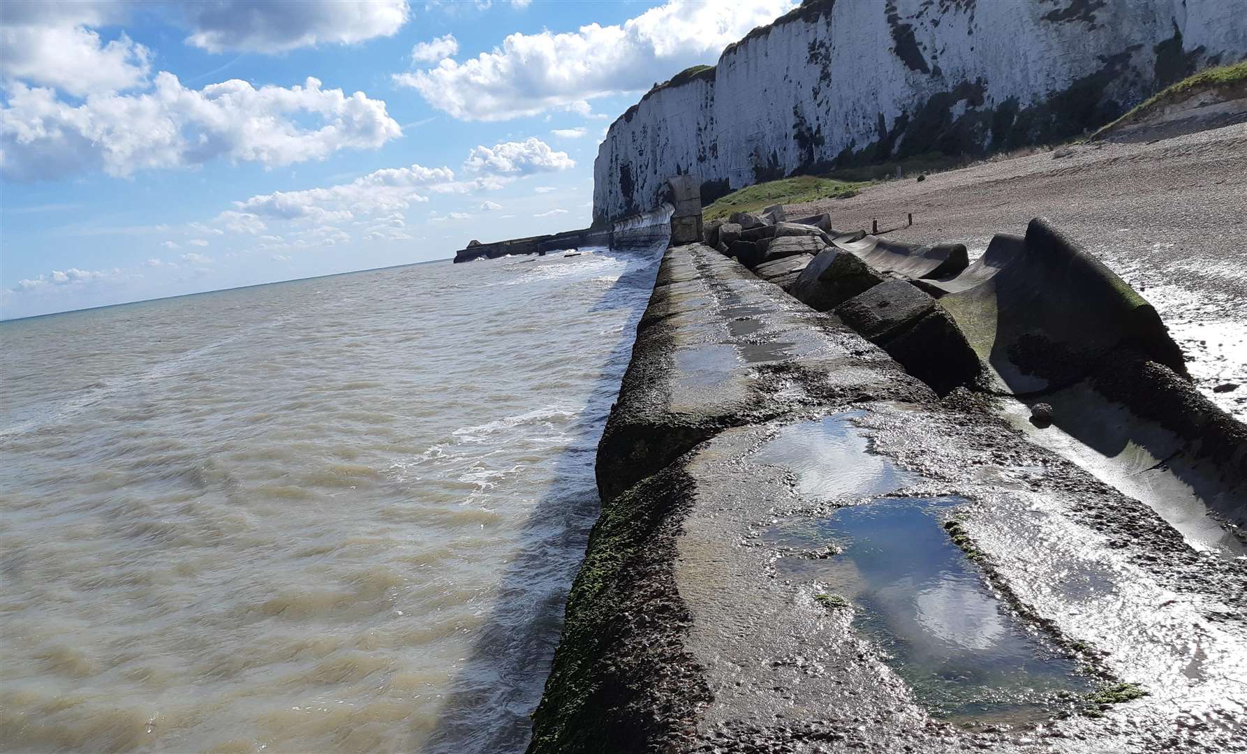 Signs around the site warn people of the dangers of the slippery wall