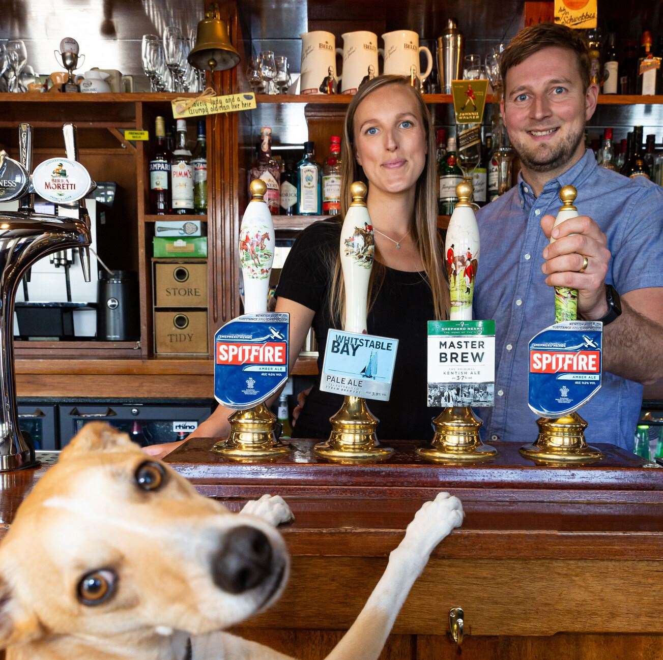 James and Hope alongside their dog, Perrita, on moving in day