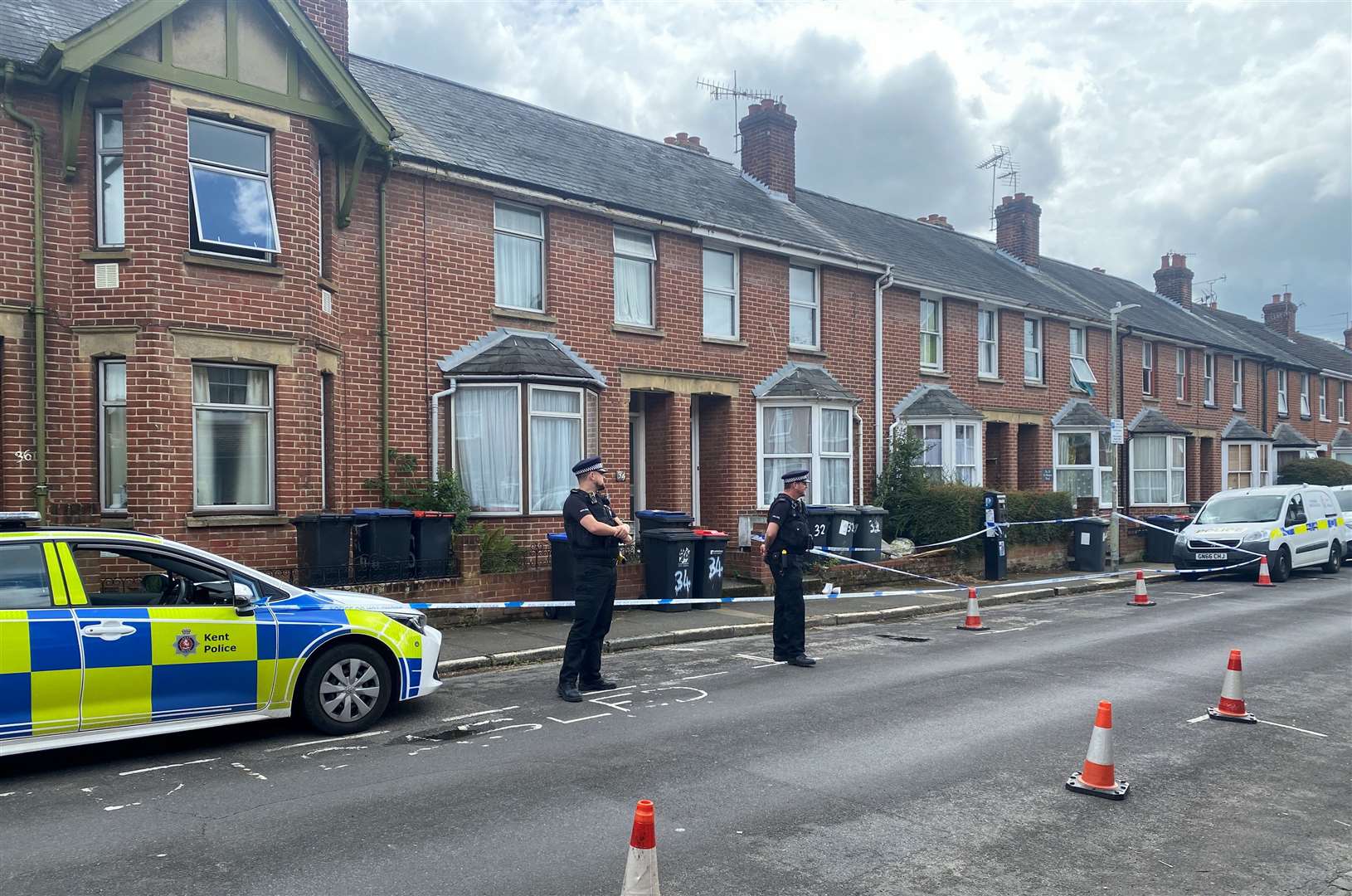 Police and forensics officers in St Martin's Road, Canterbury