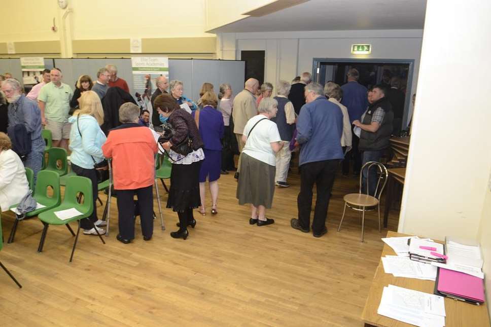 People leave the hall when the meeting was described as a presentation on the future of the Pilgrims Hospice in Canterbury