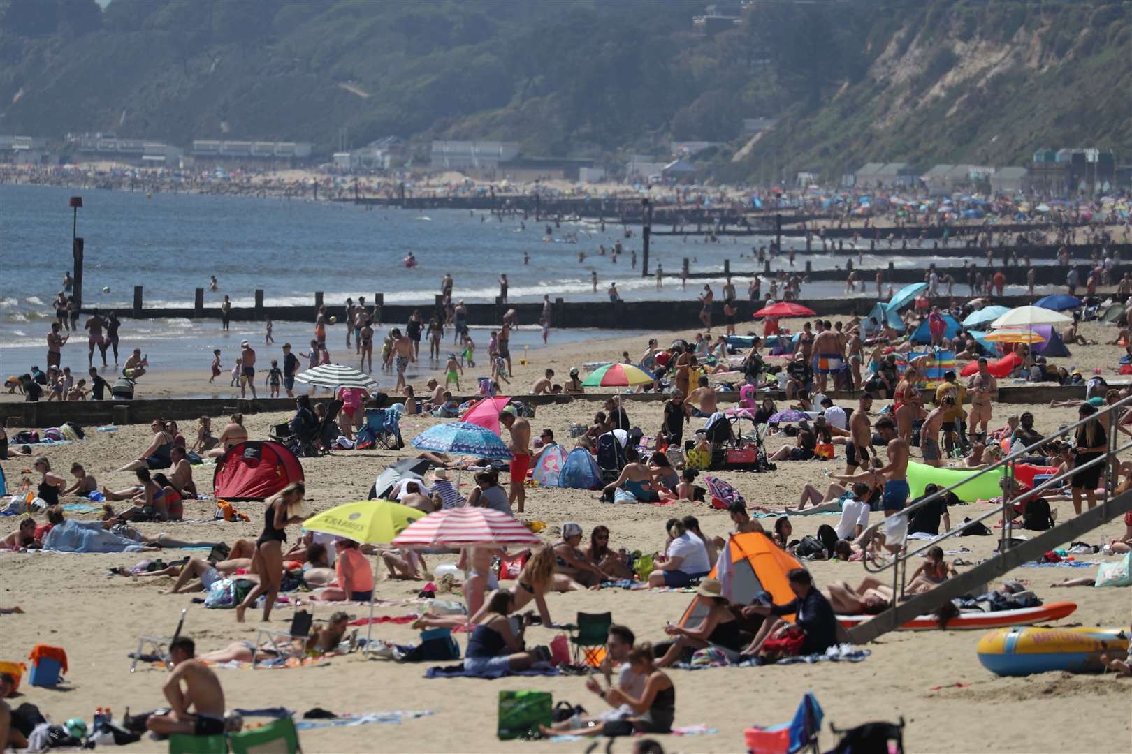 People enjoy the hot weather at Bournemouth beach in Dorset (Andrew Matthews/PA Wire)