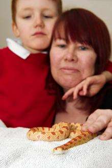 Neighbour Sarah Dawson, with son Samuel, 7, and Sid, an 18mth-old corn snake.