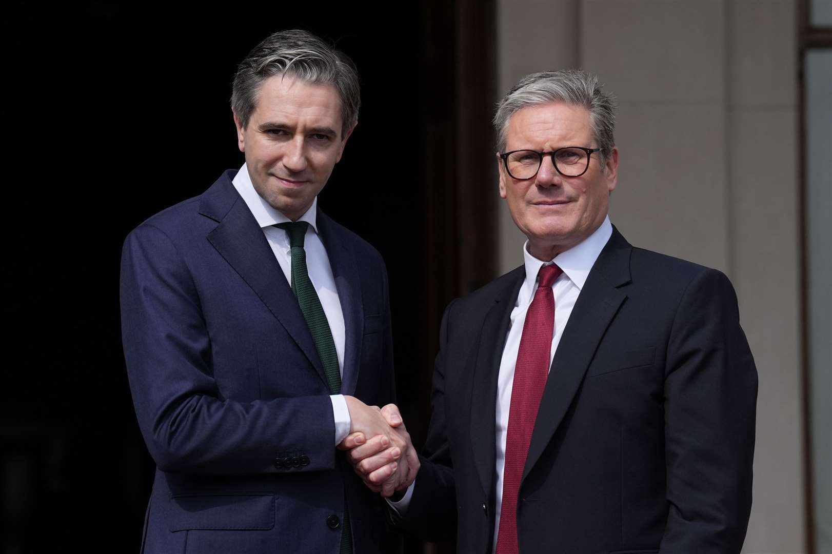 Taoiseach Simon Harris greets Prime Minister Sir Keir Starmer (Brian Lawless/PA)