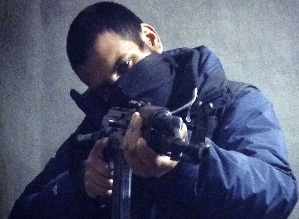 Computer hacker-turned jihadi Junaid Hussain pictured on Twitter with a rifle in his hands.