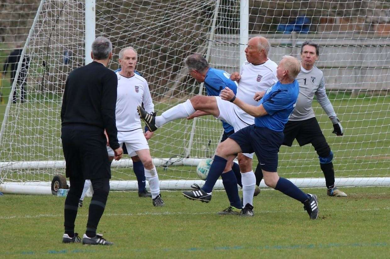 Goalmouth action as Kent snuff out an England attack.