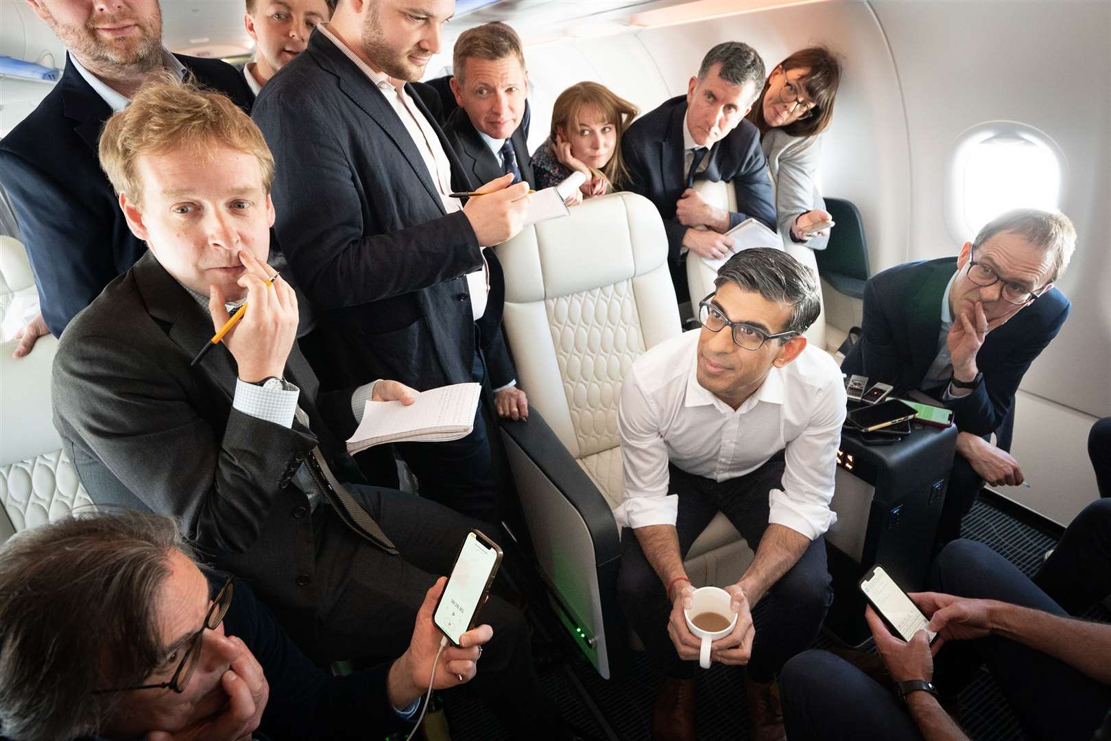 Prime Minister Rishi Sunak holds a huddle with political journalists on board a government plane as he heads to Japan to attend the G7 summit in Hiroshima (Stefan Rousseau/PA)