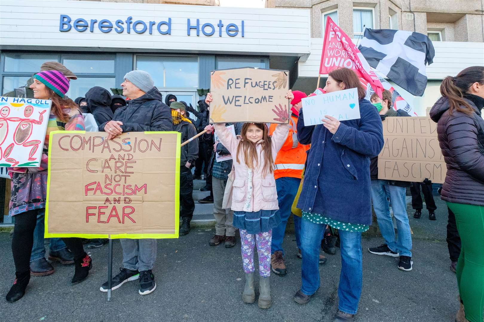 Anti-fascists from Cornwall Resists stand outside the Beresford Hotel in Newquay (PA)