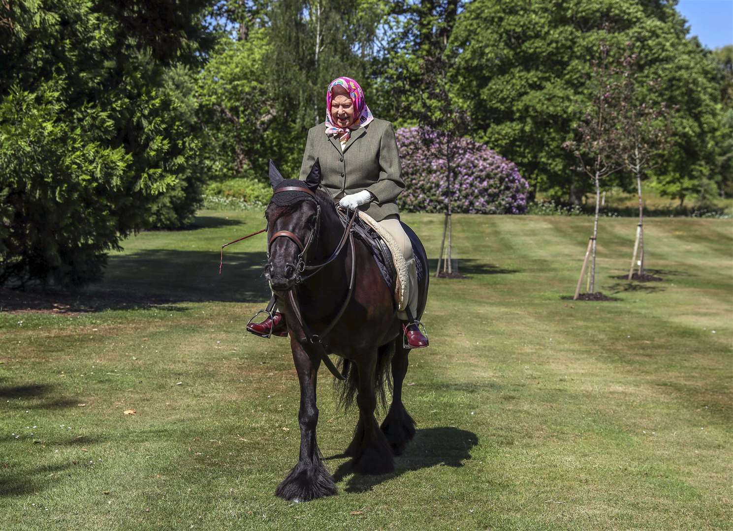 The Queen riding in Windsor Home Park in May during lockdown (Steve Parsons/PA)