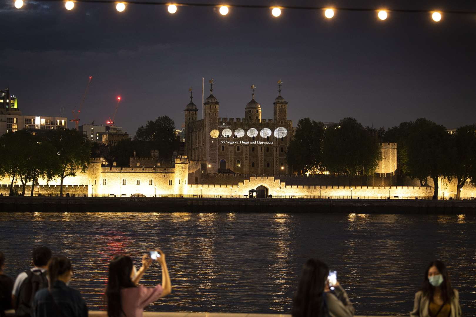 Onlooked watch the display on Wednesday night (Doug Peters/PA)