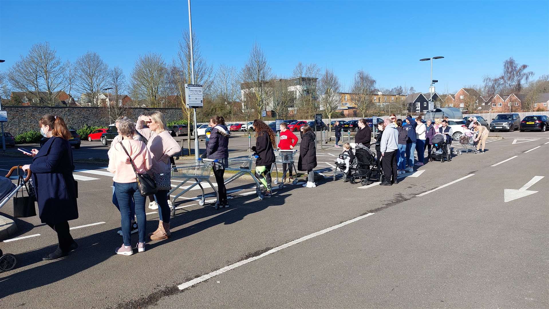 Shoppers queueing outside the store before 9am