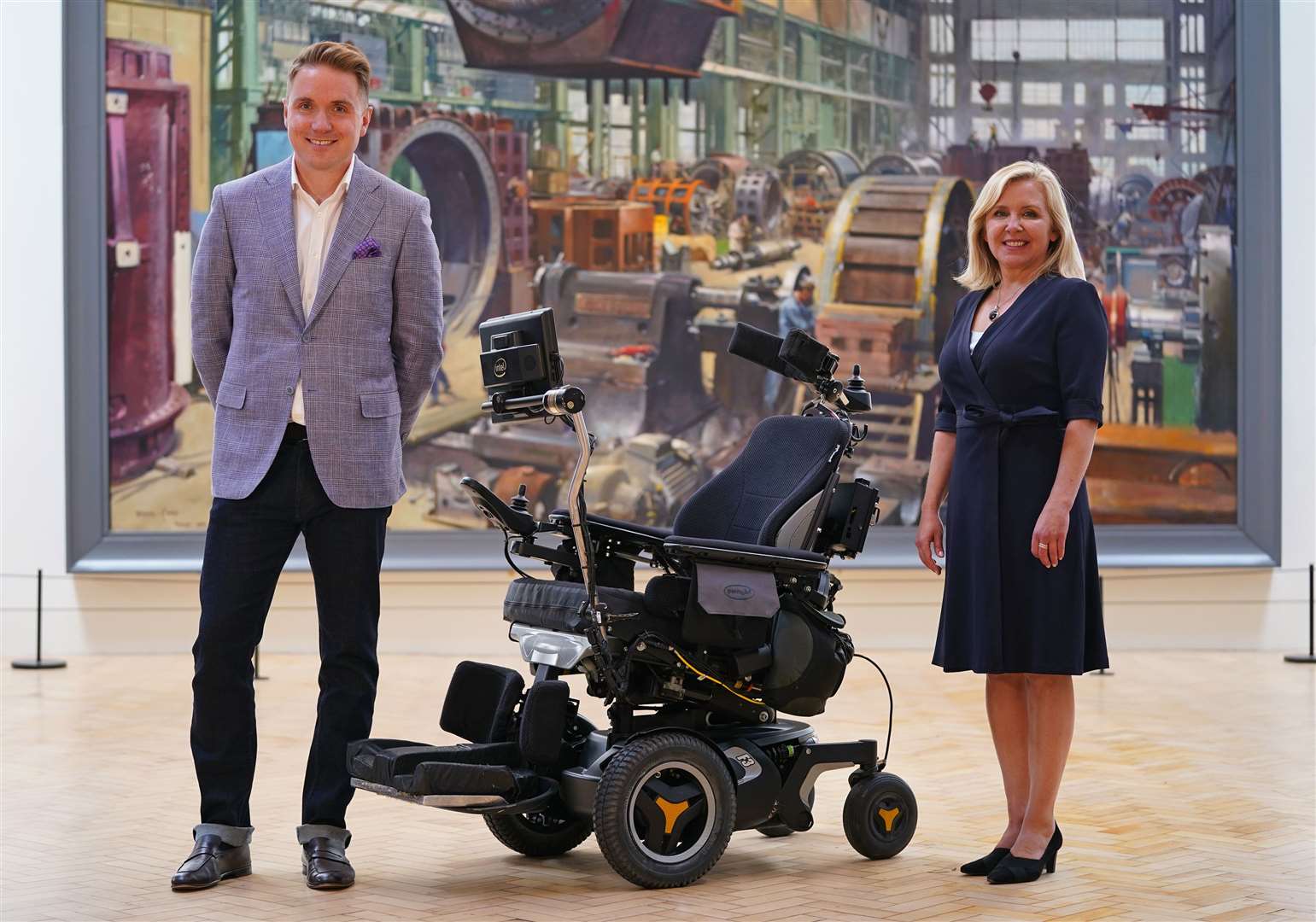 Tim and Lucy Hawking with Professor Hawking’s Permobil F3 model wheelchair (Yui Mok/PA)