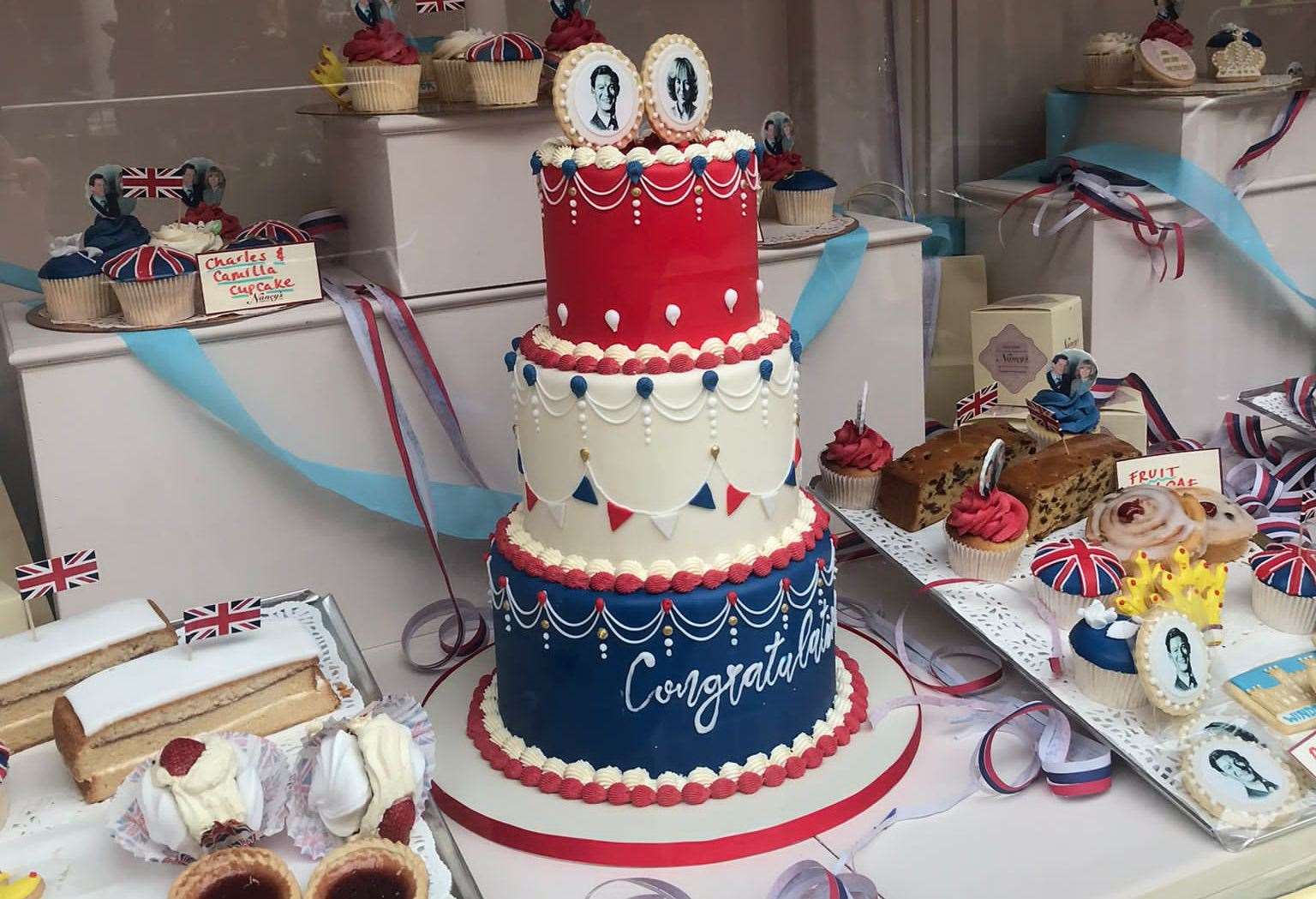 A Charles and Camilla cake in a Rochester High Street shop window following its Netflix makeover. Picture: Sharon Edwards