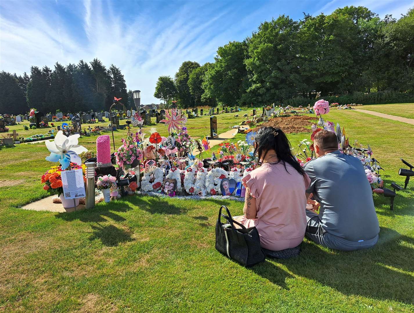 Alisha Ponter's mother Cody Hobman with her husband Aaron at Hawkinge Cemetery