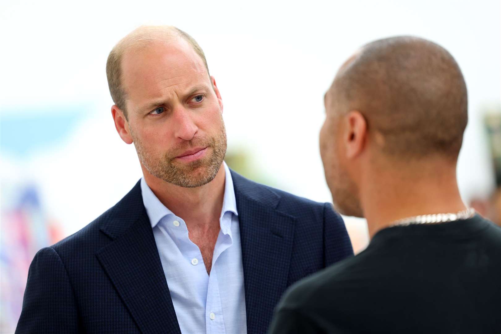 William, sporting his new beard, speaks to artist Robi Walters as he tours the exhibition (Chris Jackson/PA)