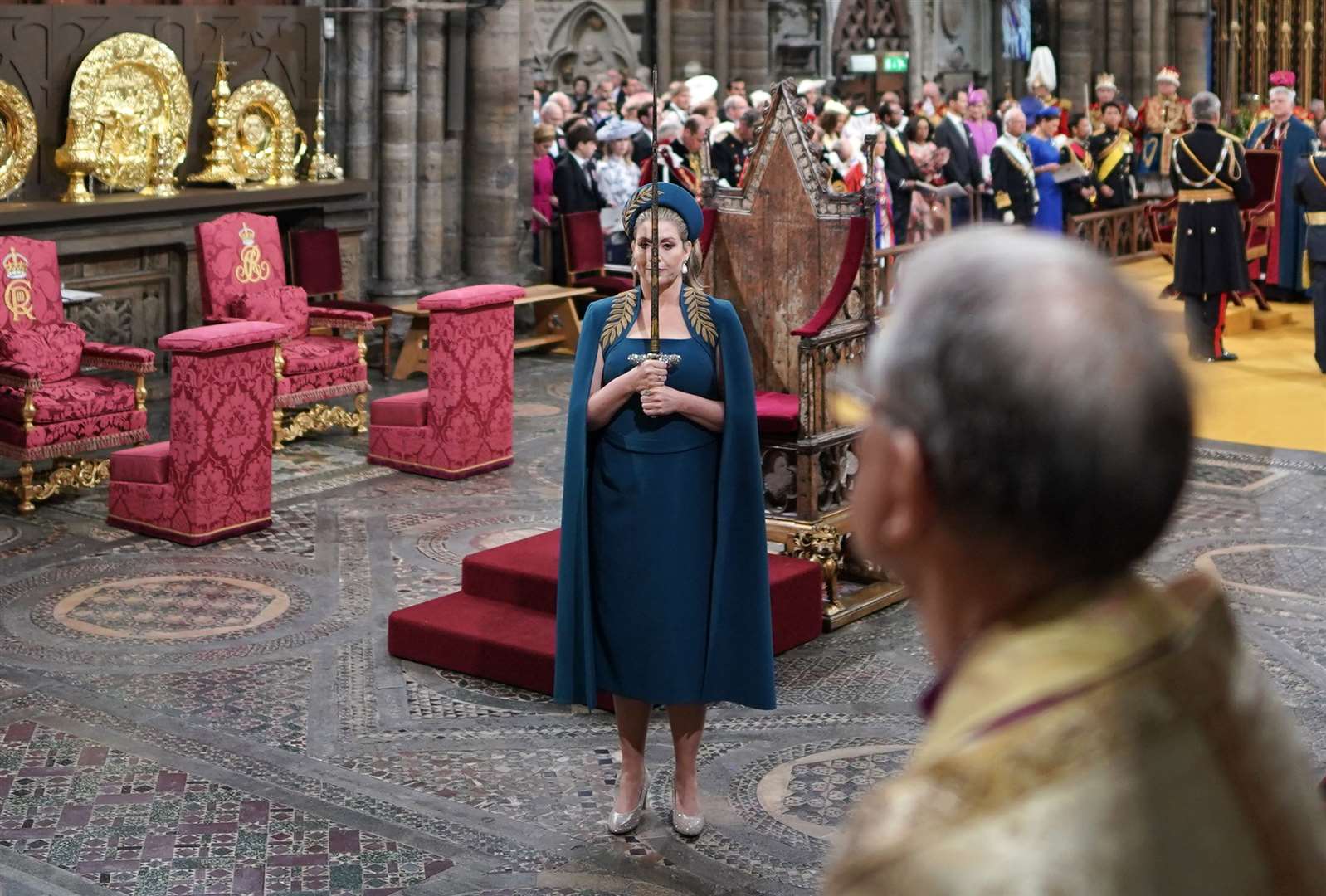 Penny Mordaunt holds the Swords of State at the coronation ceremony (PA)