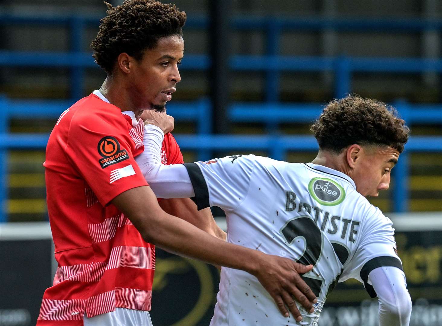 Dover's Luke Baptiste is closely marked by Sido Jombati. Picture: Stuart Brock