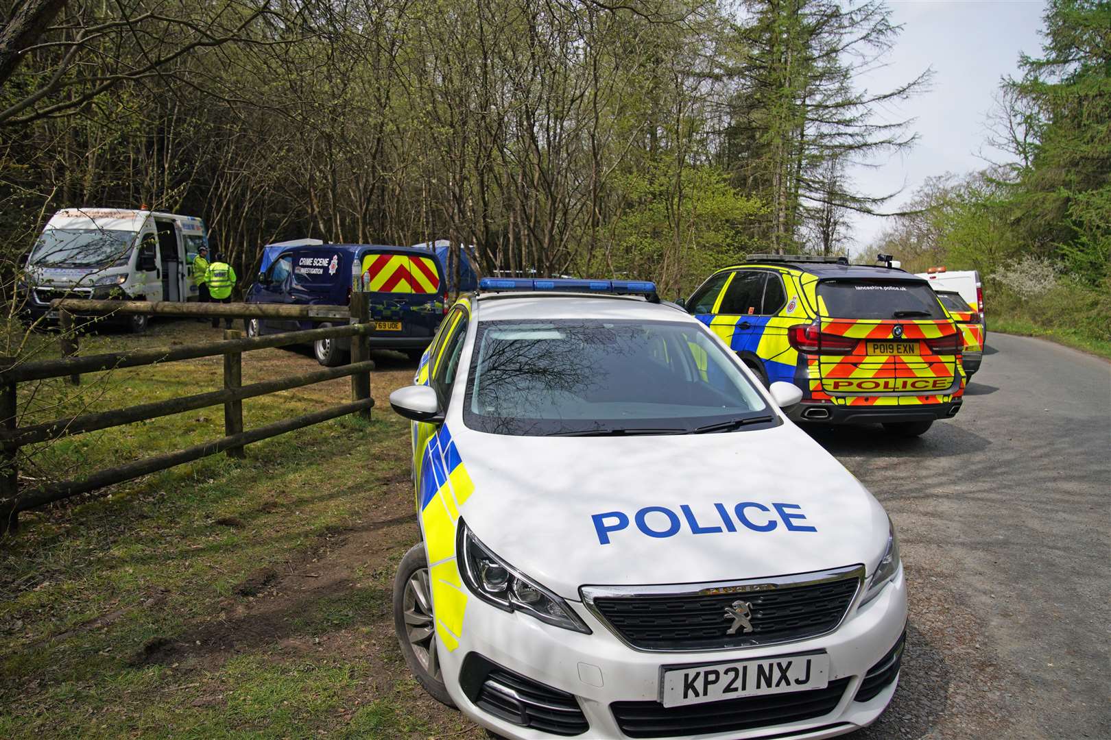 Police at the scene where a body has been found in the search for missing mother Katie Kenyon (Peter Byrne/PA)