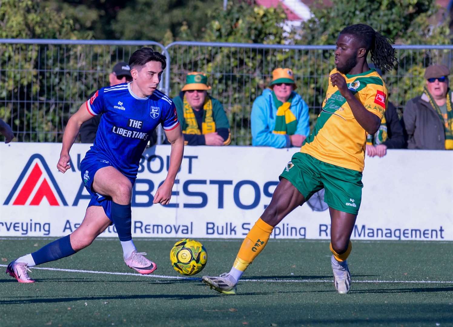 Margate right-back Harrison Hatfull takes on Horsham forward Daniel Ajakaiye. Picture: Stuart Watson