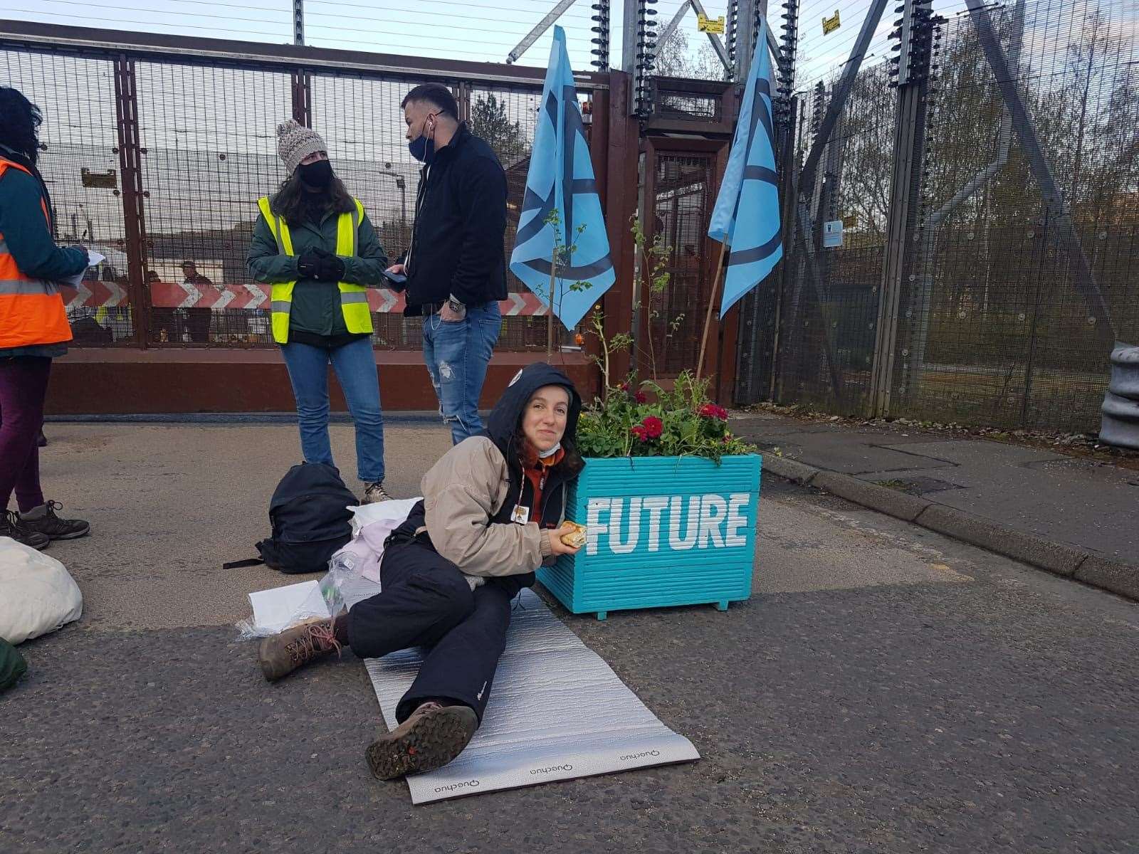 The activists are locked to the planters (Extinction Rebellion Scotland/PA)