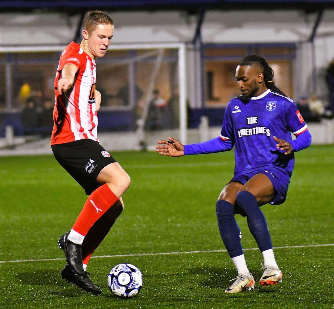 Defender Joe Tyrie, pictured playing for Sheppey earlier in the season against Margate’s Ibrahim Olutade, has joined Folkestone and made his club bow against Dartford. Picture: Marc Richards