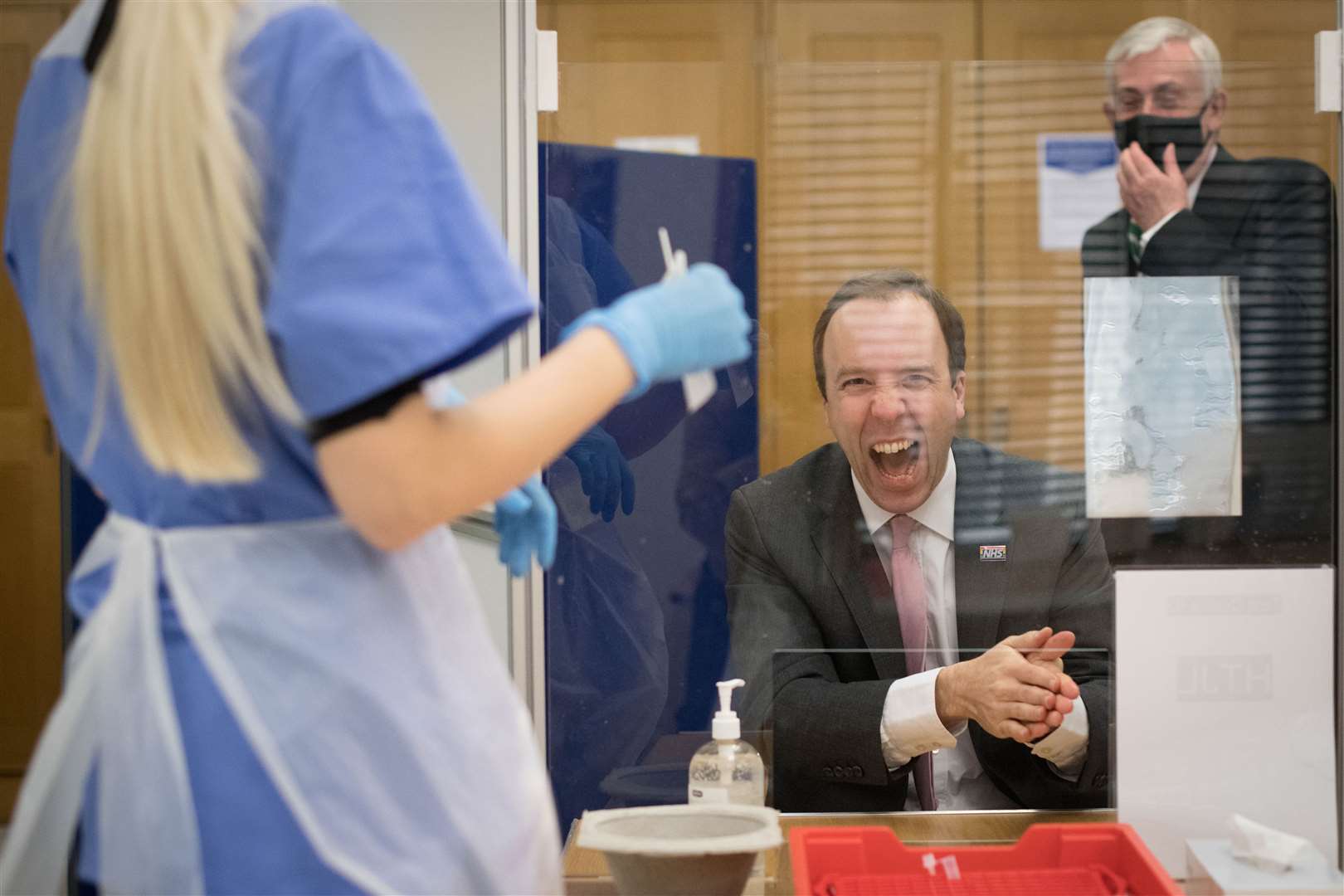 Health Secretary Matt Hancock takes a coronavirus test at a new Covid-19 testing facility in the Houses of Parliament, watched by Commons Speaker Sir Lindsay Hoyle (Stefan Rousseau/PA)