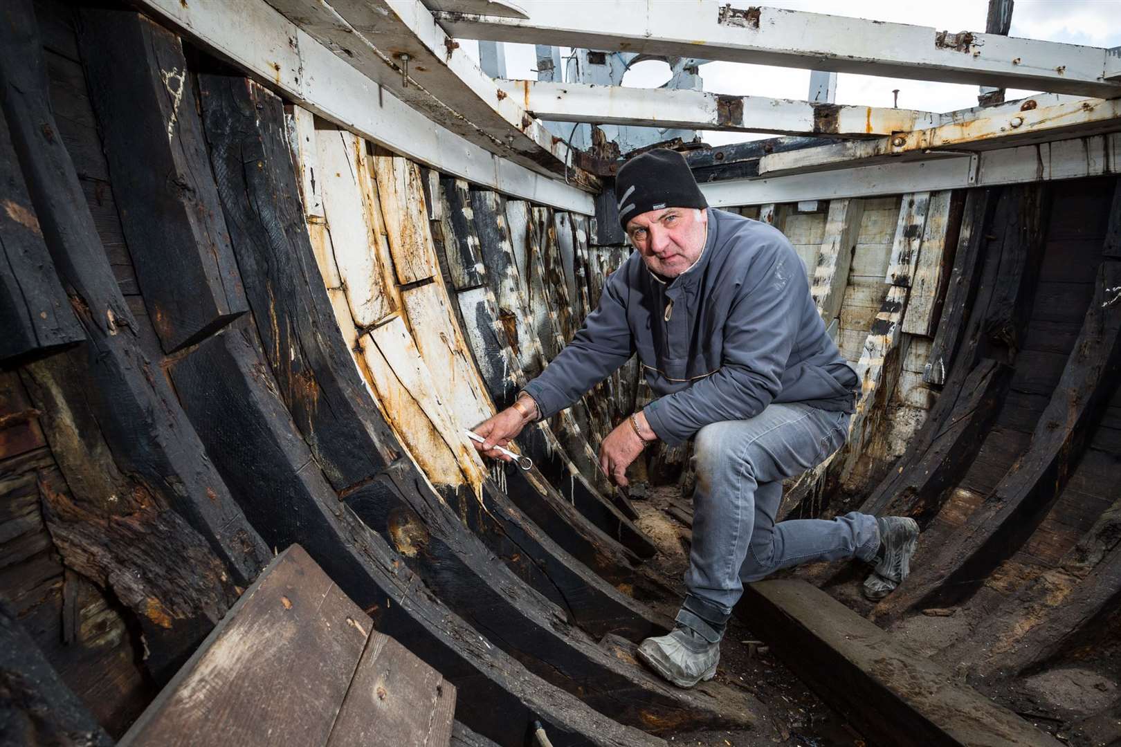 Volunteer David Britten is helping restore the oyster yawl