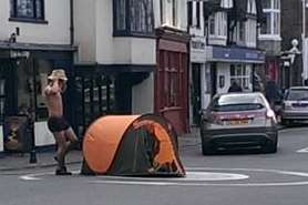 Canterbury prankster Shayan Sheyegani pitches tent on a mini-roundabout near the Westgate Towers. Picture: Neil Haffenden