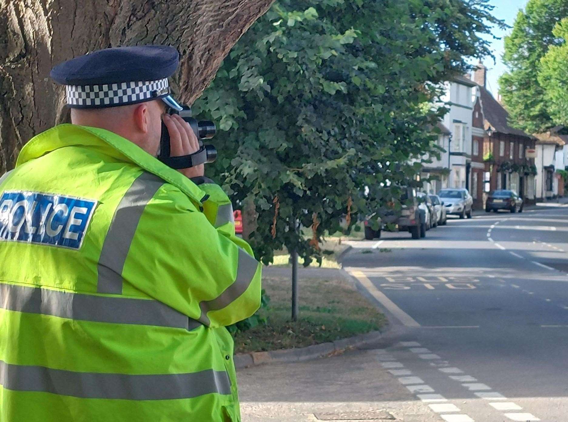 A police officer monitoring speeds in Wingham High Street. Picture: Kent Police