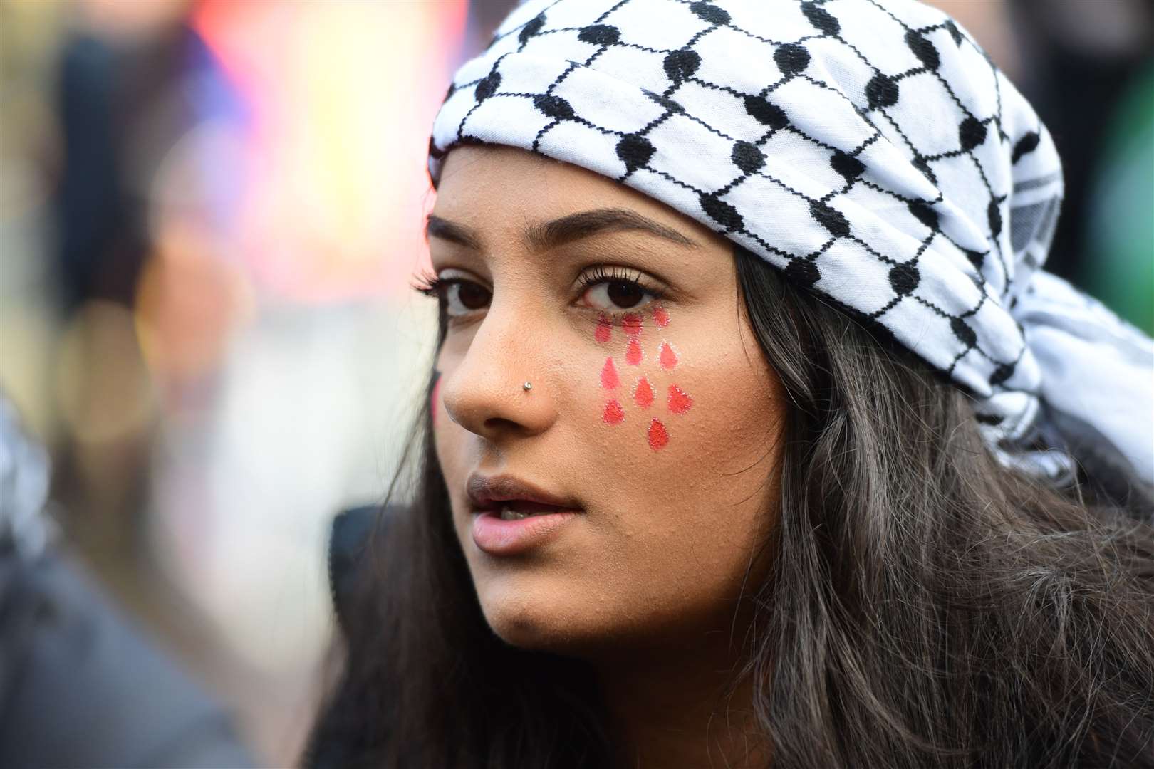 Protesters gather near to the Israeli embassy in Kensington (Ian West/PA)