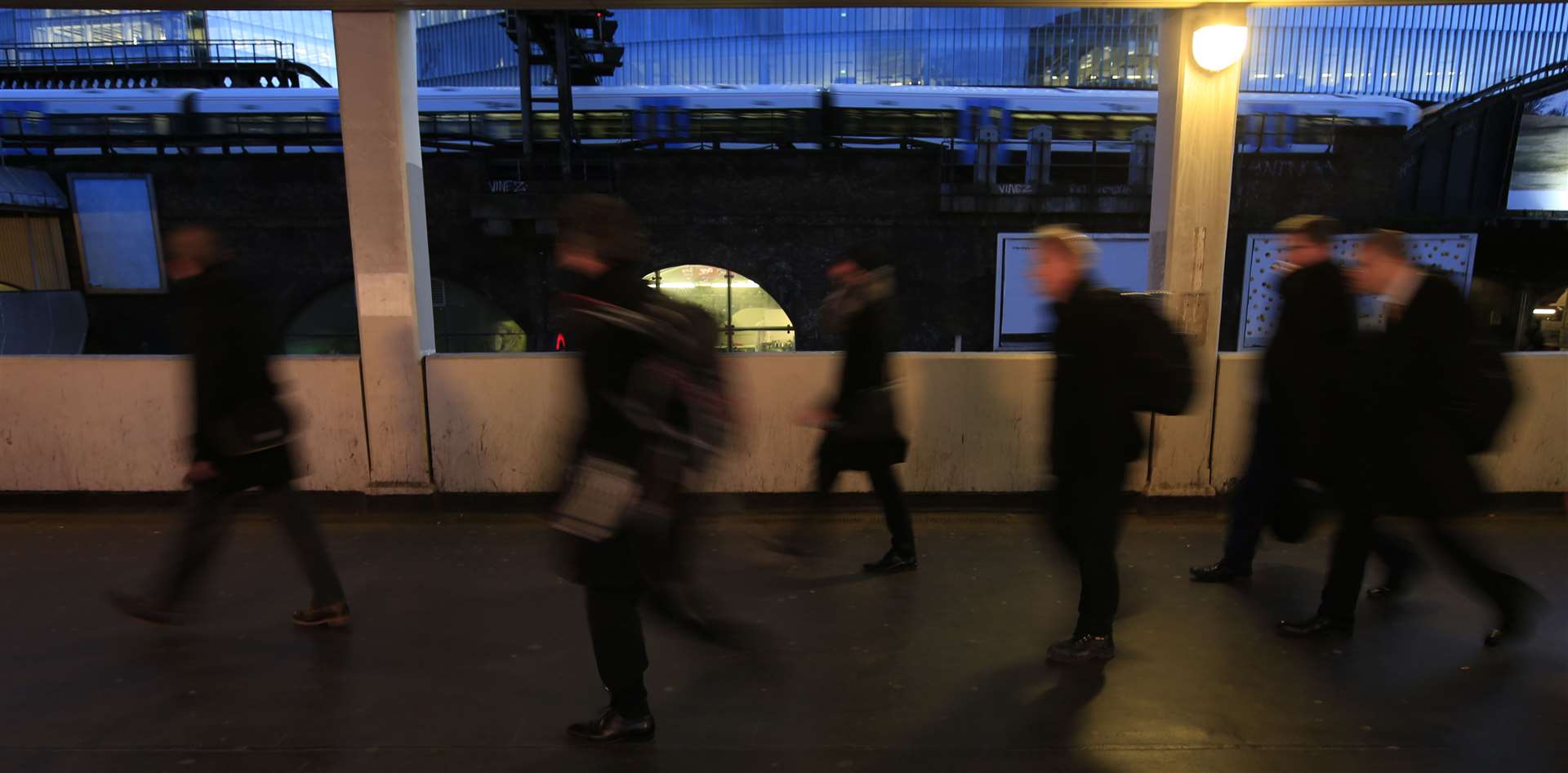 Commuters make their way into London Bridge Underground and railway stations (Jonathan Brady/PA)