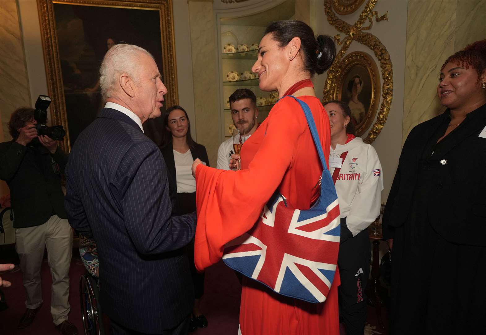 The King talking to Dame Sarah Storey (Yui Mok/PA)