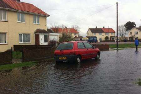 The rain water in Canute Road is shin-high at its deepest