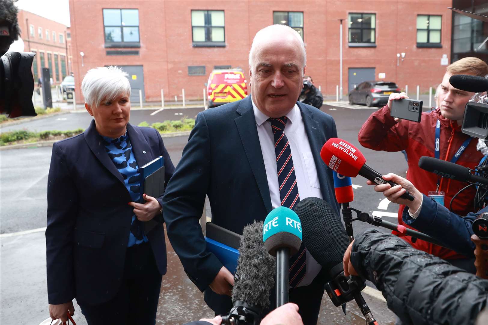 Policing Board members Joanne Bunting and Trevor Clarke arriving at James House (Liam McBurney/PA)