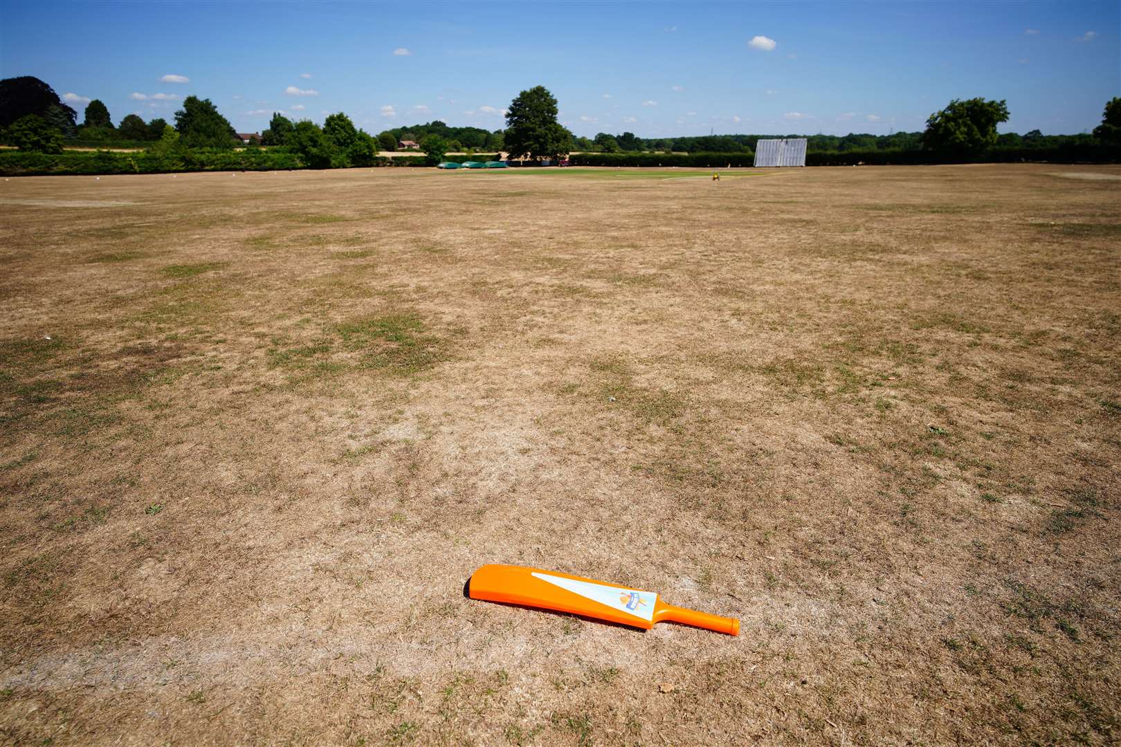 Parched grass at the cricket green in the village of Odiham in Hampshire (Ben Birchall/PA)