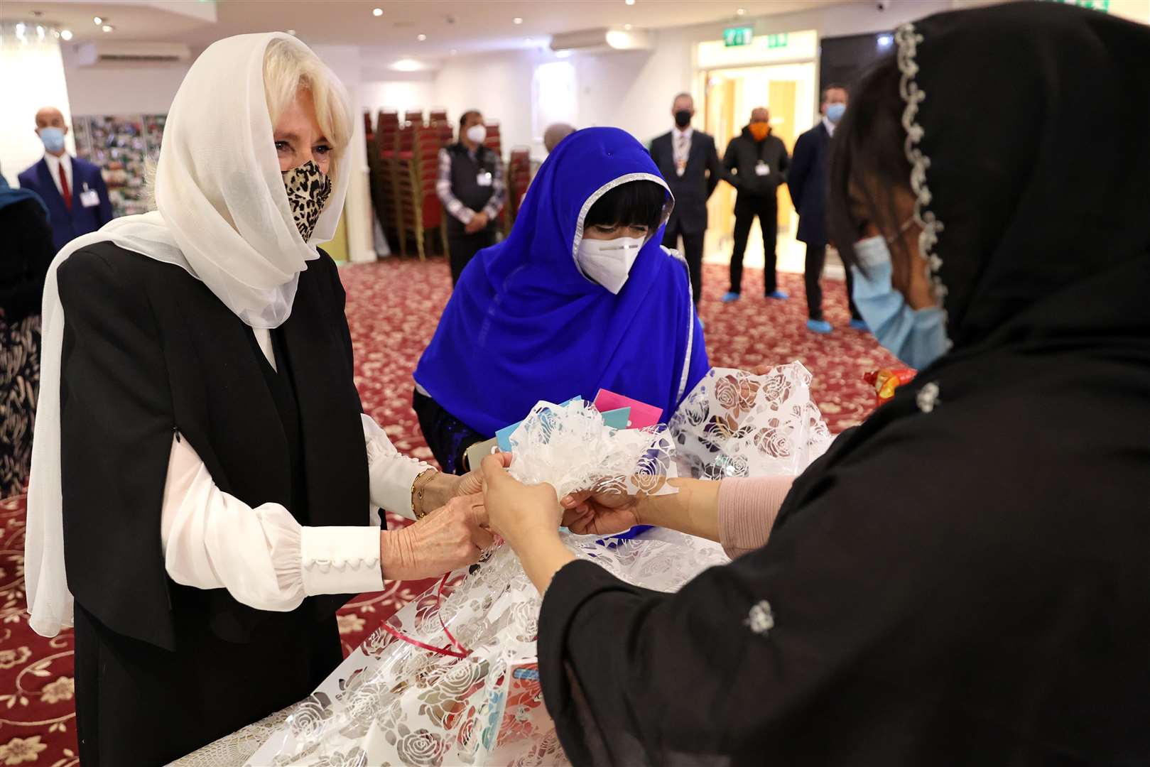 Wearing a headscarf and mask the duchess helped fill Iftar boxes destined for children observing Ramadan (Chris Jackson/PA)