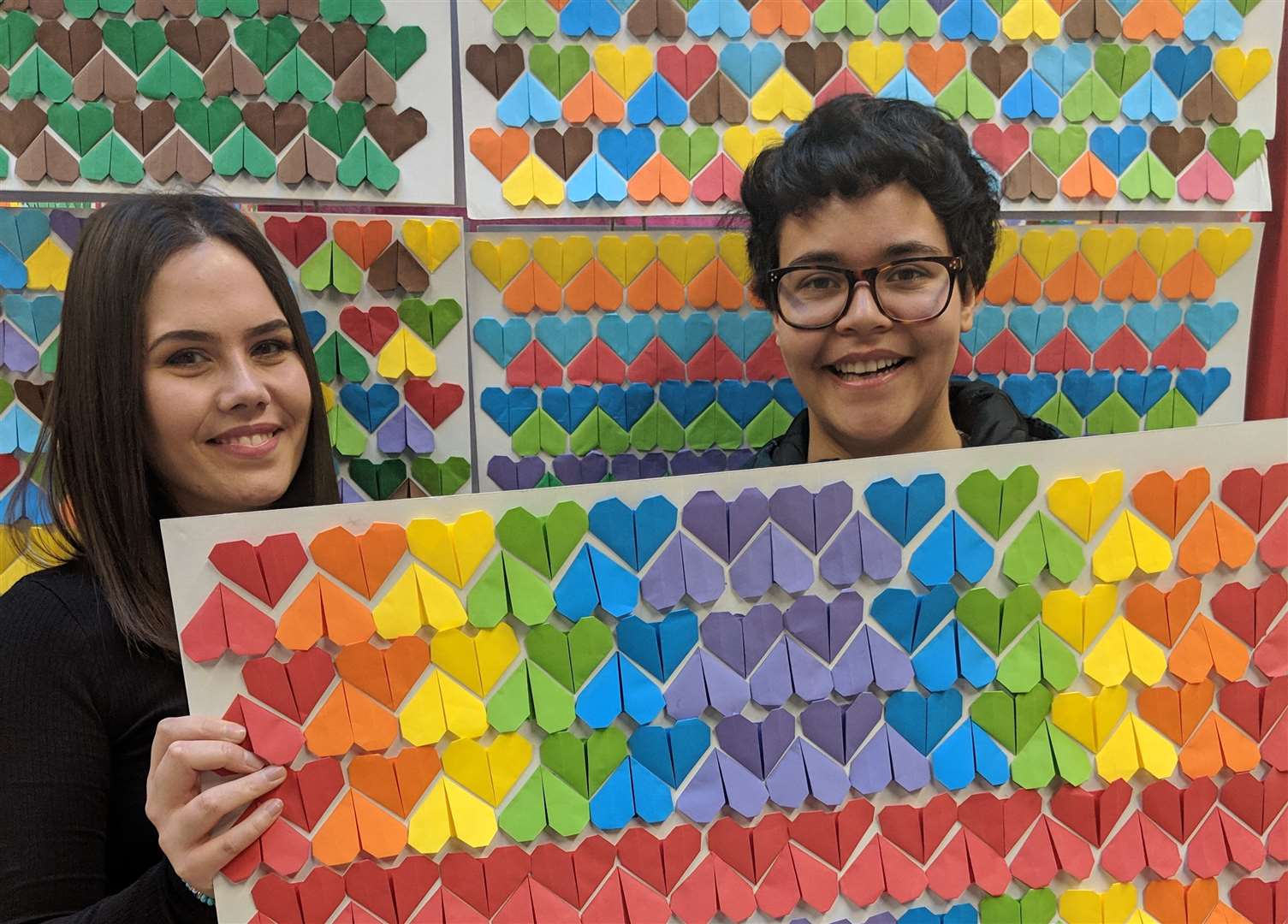 Students with some of the origami paper hearts which saw them enter the Guinness Book of Records
