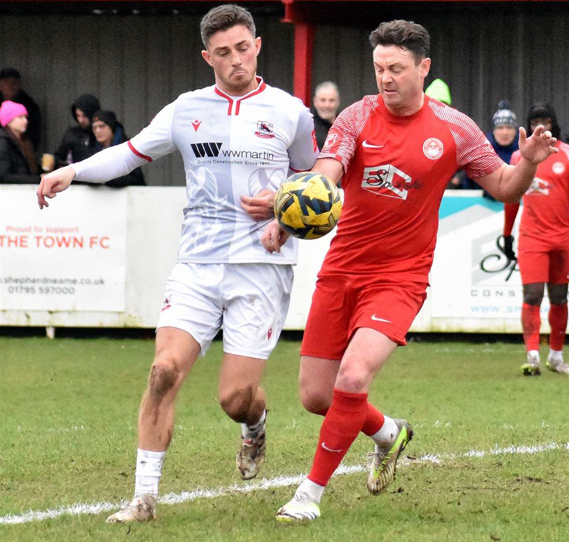 Faversham summer signing Frannie Collin, right, battles for Hythe against Ramsgate’s Jack Paxman in Isthmian South East earlier this year. Picture: Randolph File