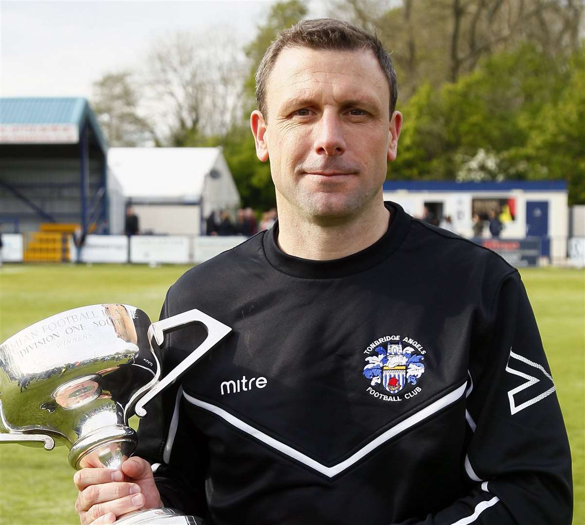 Tonbridge boss Steve McKimm with the Bostik Premier play-off trophy Picture: Sean Aidan