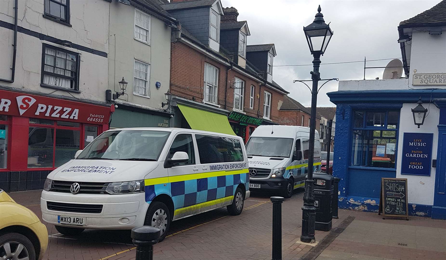 Two immigration enforcement vehicles were parked near Park Mall