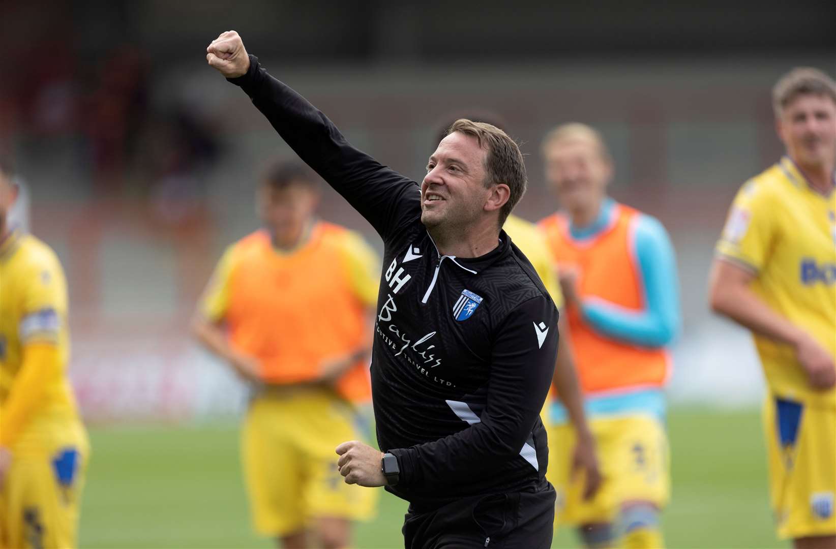 Gillingham kit man Brad Haywood celebrating a win on the road Picture: @Julian_KPI