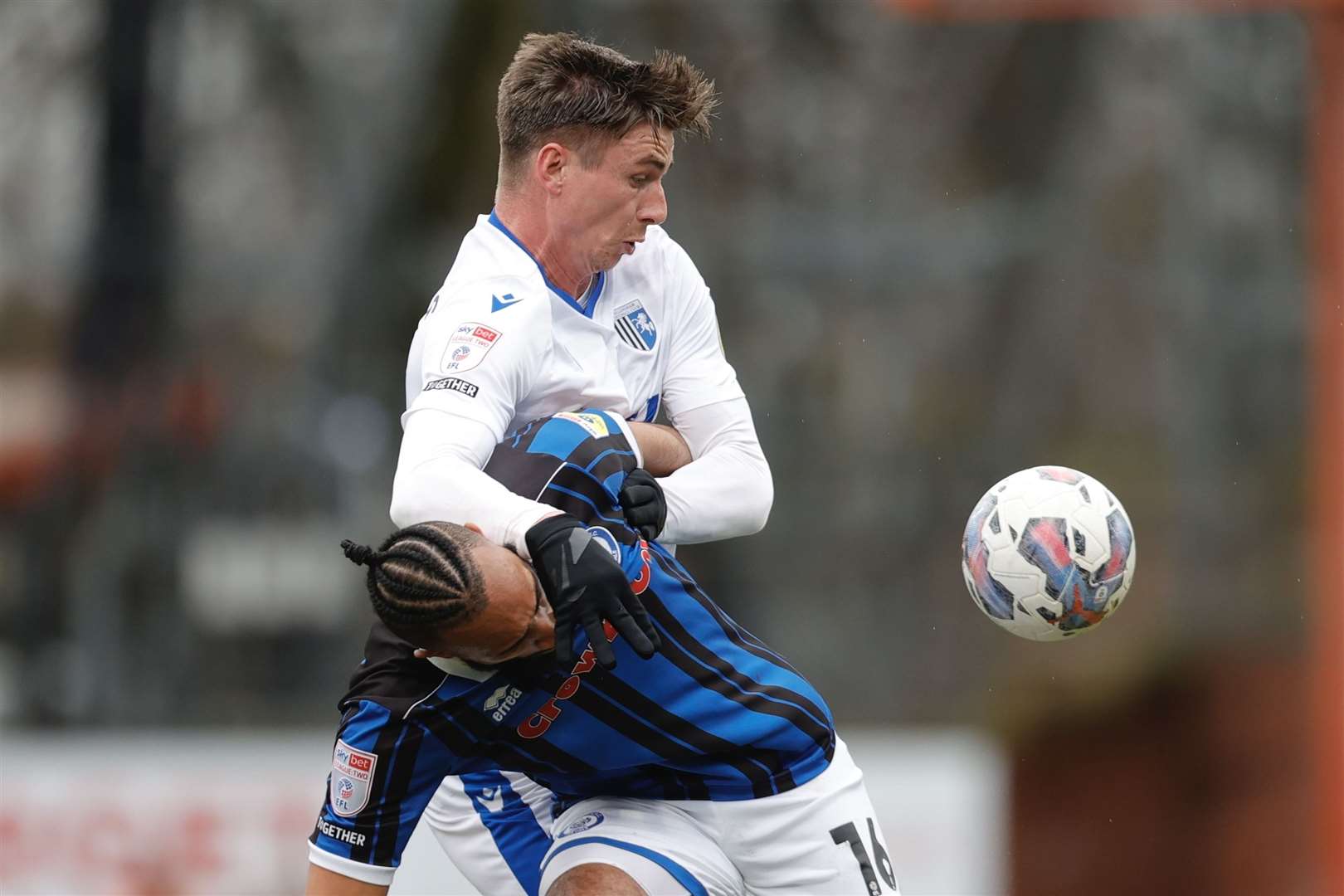 Goalscorer Oli Hawkins challenges Rhys Bennett for the ball in the League 2 match at Spotland