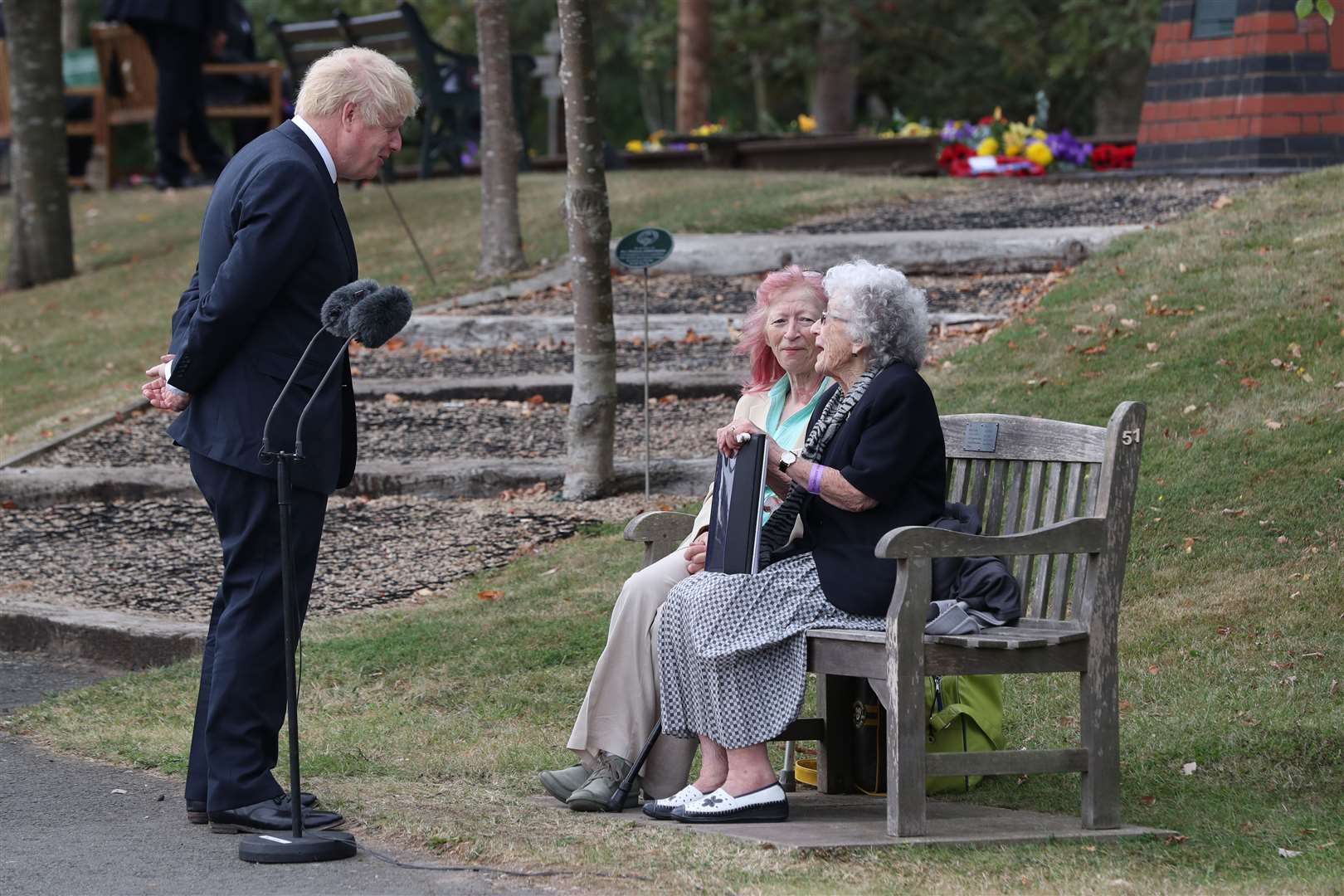 Prime Minister Boris Johnson speaks to guests (Peter Byrne/PA)