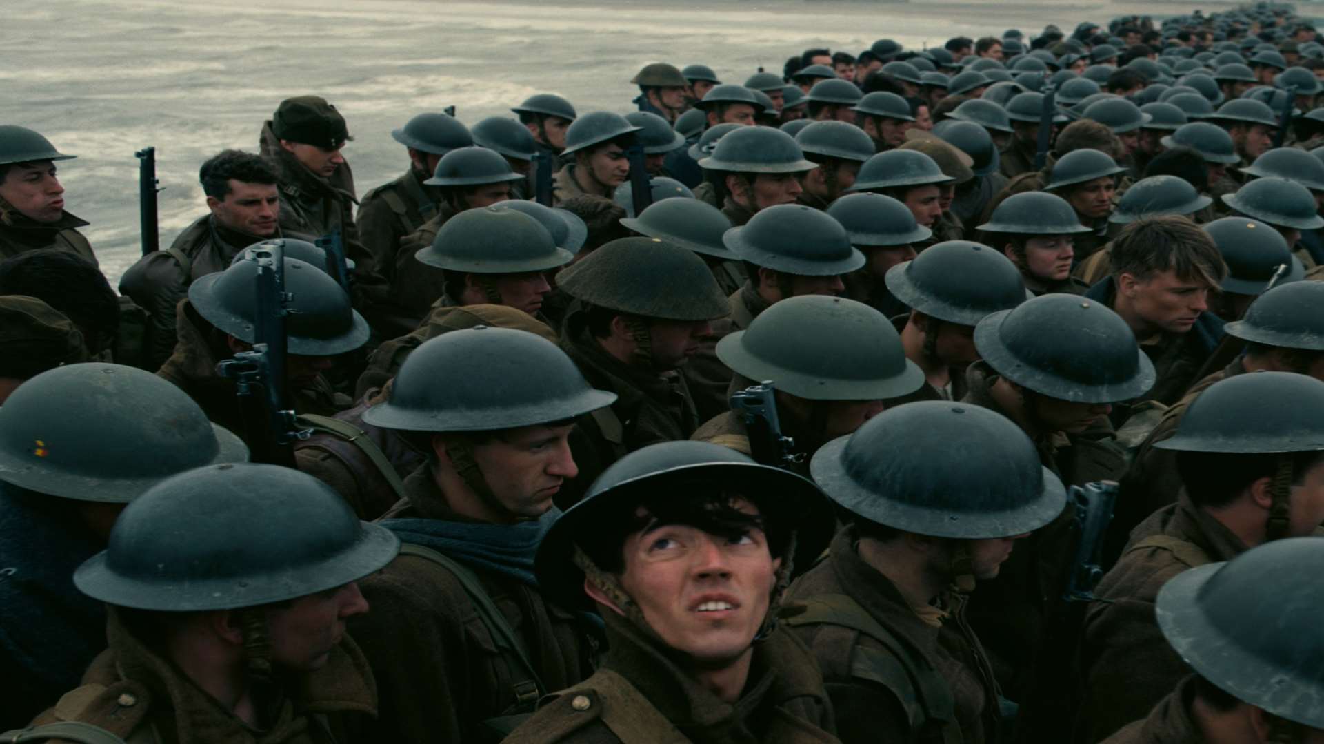 A scene from Christopher Nolan's Dunkirk as troops wait for a rescue from the East Mole of the harbour