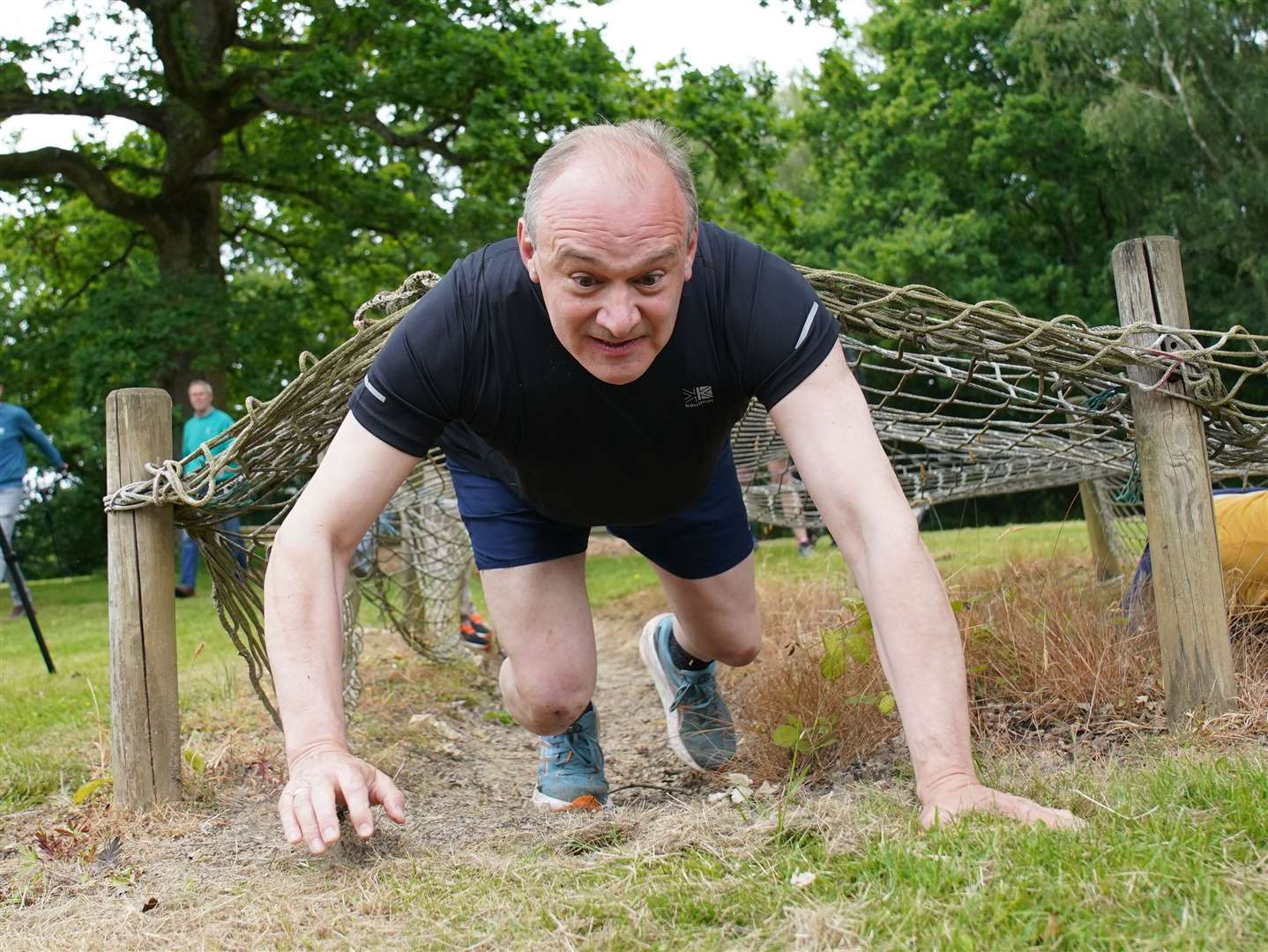 Sir Ed Davey on an assault course during a campaign visit to Kent (Gareth Fuller/PA)